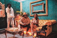 two people sitting on a couch in a living room
